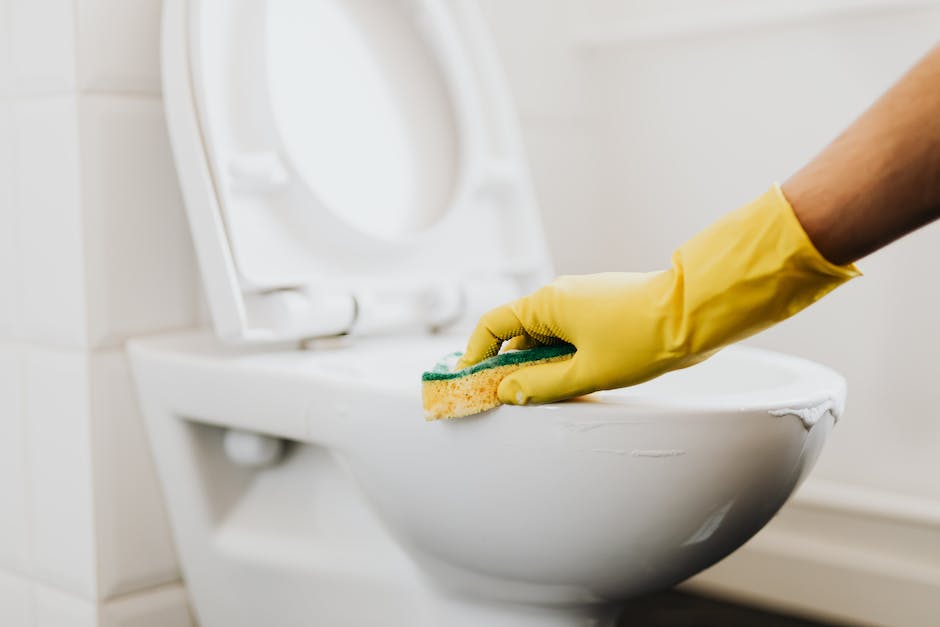 Illustration of a person fixing a toilet tank issue